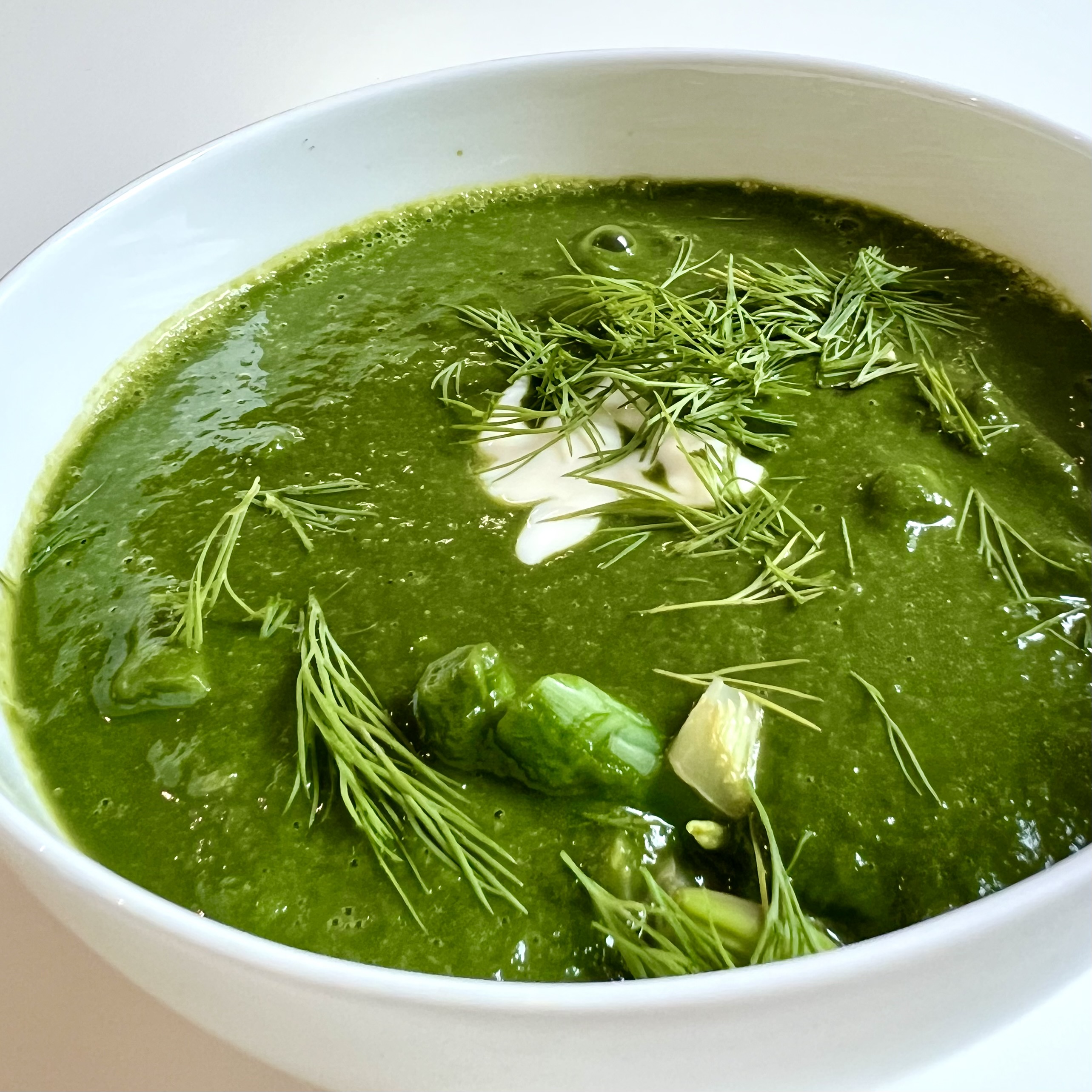 Vibrant green nettle soup with dill and cream, from the cookbook