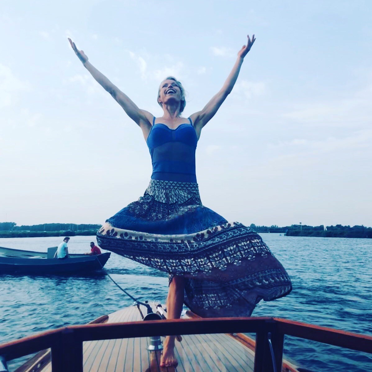 Hanna at the Yoga and Ayurveda summer workshop, arms open, joyful