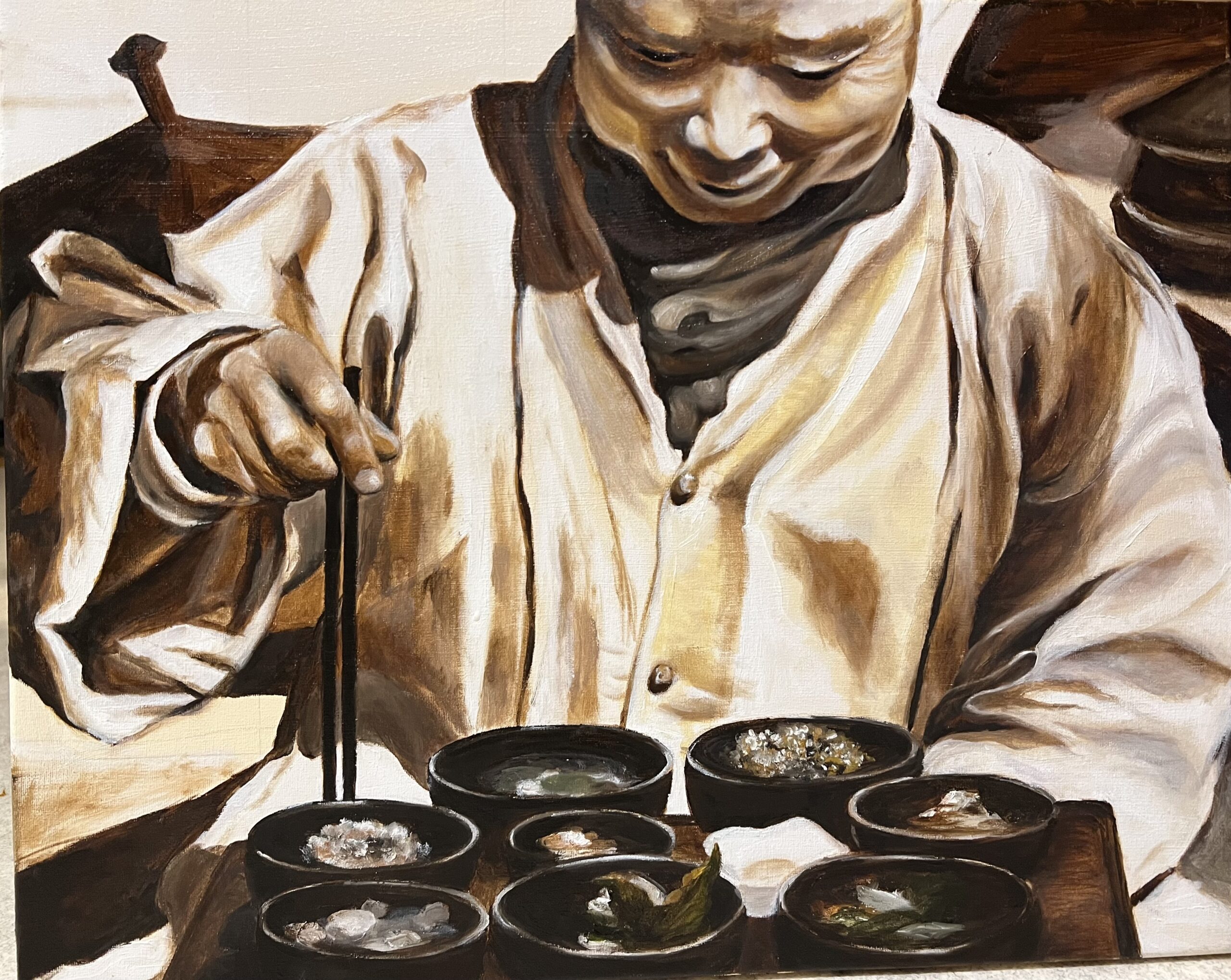 Hanna's painting — a figure tending to small bowls with chopsticks, inspired by her time in Asia